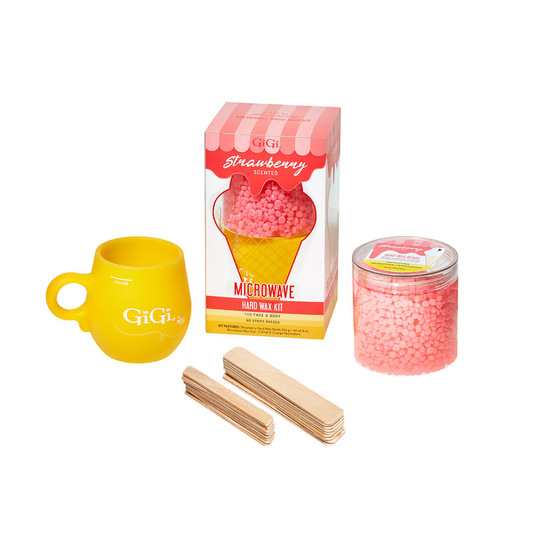 GiGi Strawberry Microwave Hard Wax Kit with mug, pink wax beads, and applicator sticks