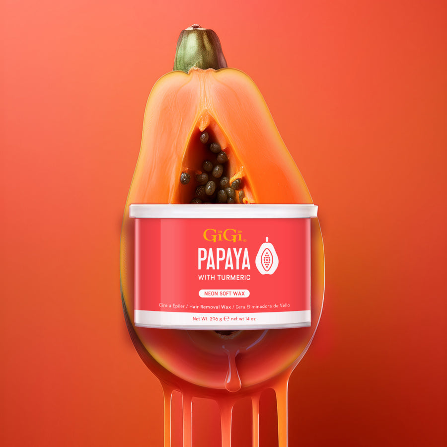 Papaya-shaped wax container with GiGi branding on an orange background