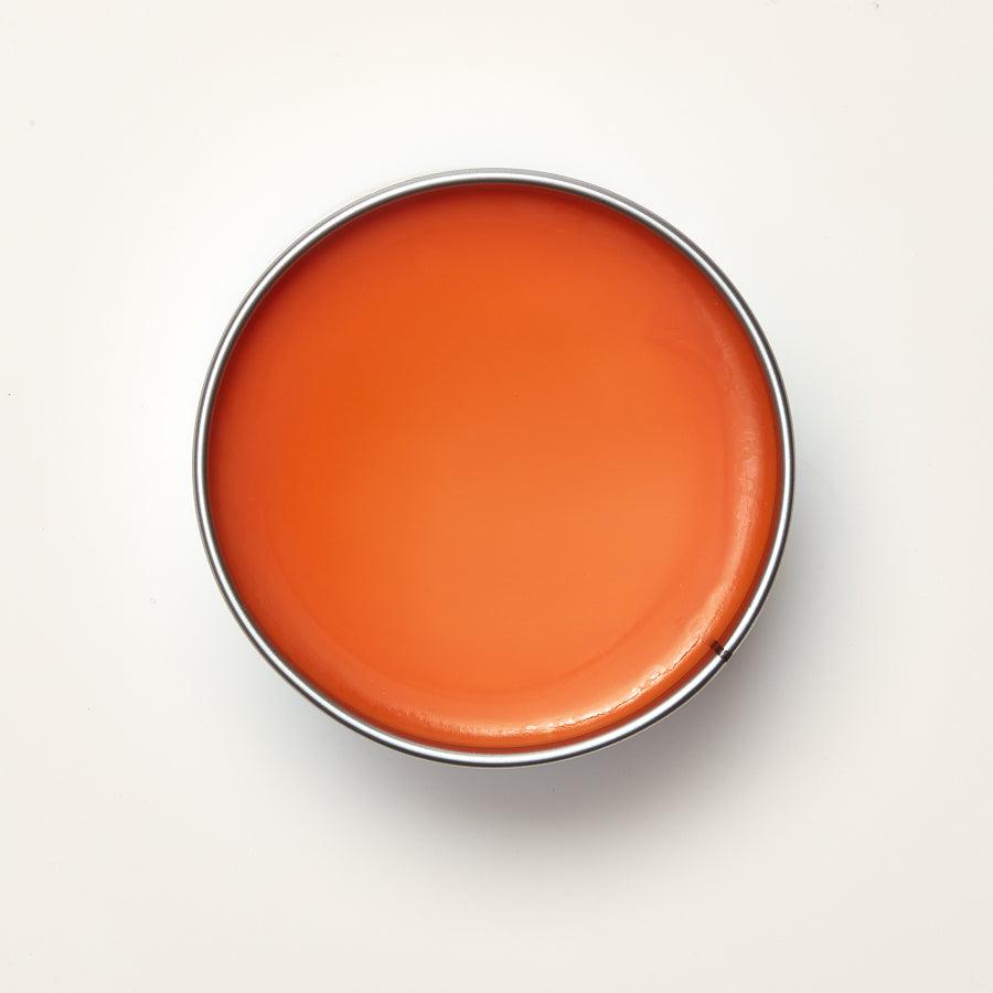 Round orange wax  on a white background