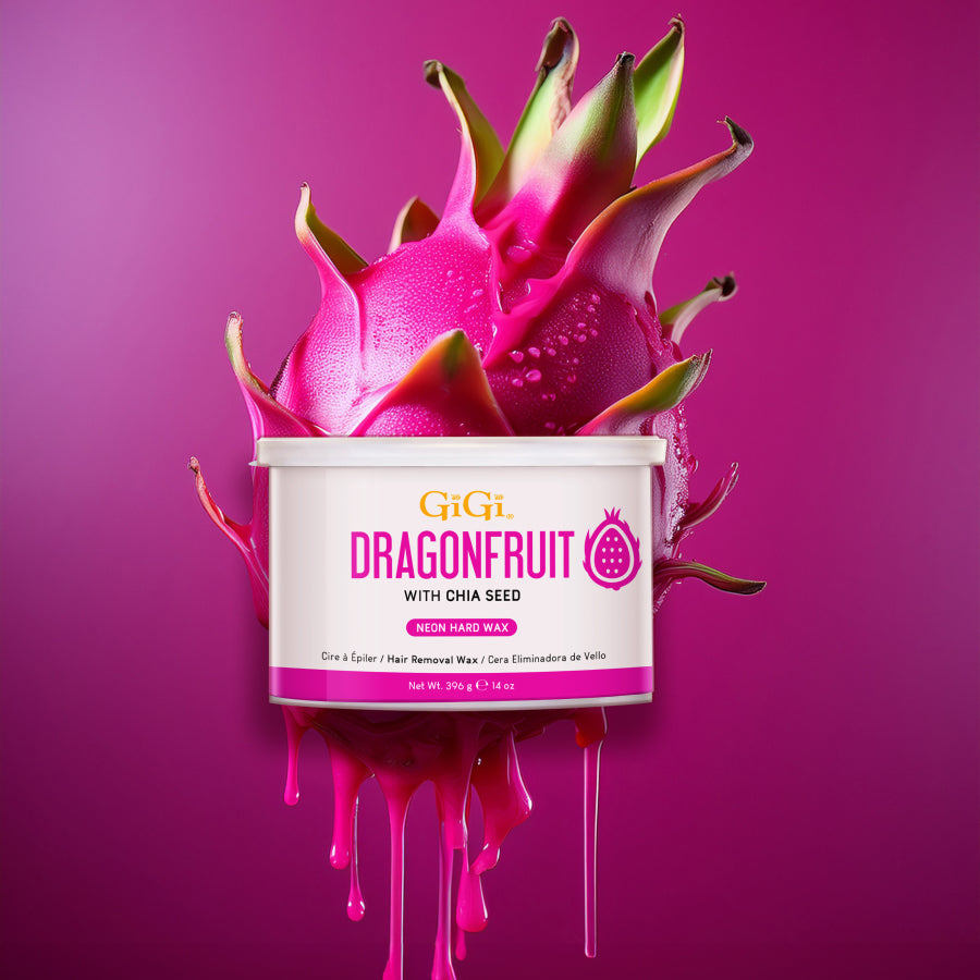 Container of GiGi Dragonfruit hair removal wax with a dragon fruit on a pink background