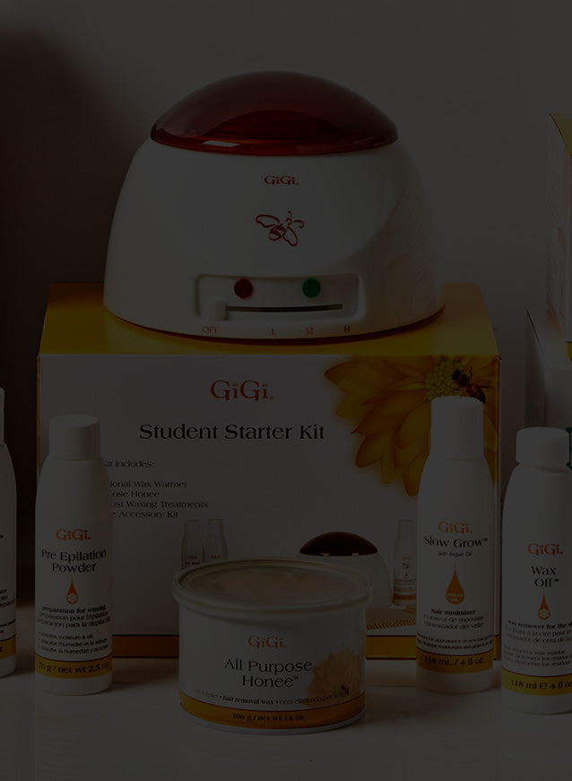 Collection of GiGi waxing products including starter kit, Brazilian wax kit, and hair removal items on a white background.