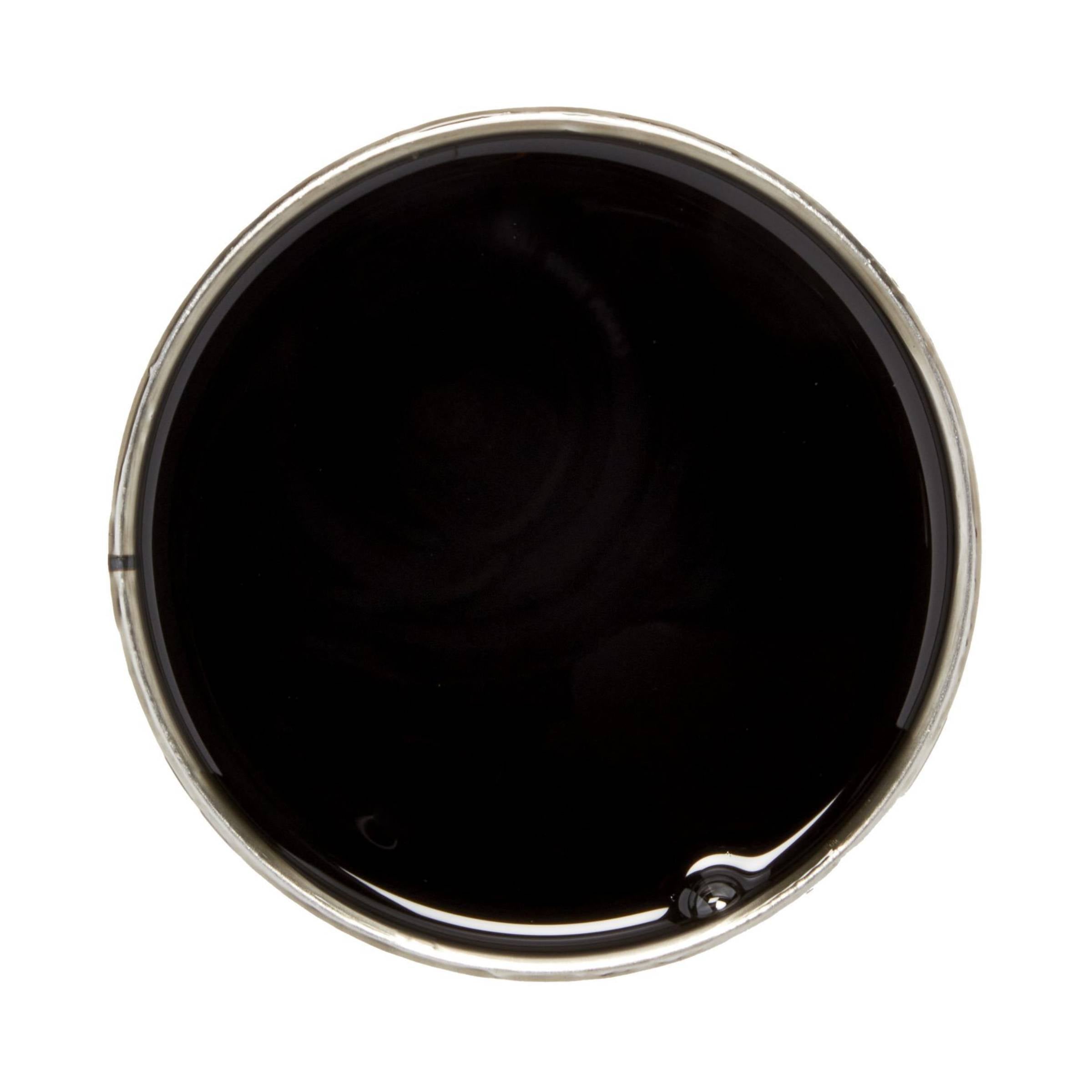 Top-down view of a round container filled with dark wax or liquid, centered against a plain black background.