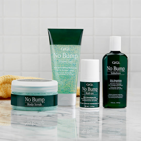 GIGI No Bump skincare products including scrub, gel, roll-on, and solution on a reflective surface with a tiled wall background.