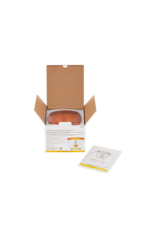 GiGi Mini Honee Wax Warmer retail box with open top flaps showing the wax warmer's orange lid; manual laid by the box's side
