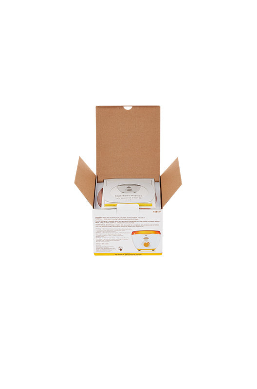 GiGi Mini Honee Wax Warmer retail box with open top flaps showing instruction manual on top of wax warmer's orange lid