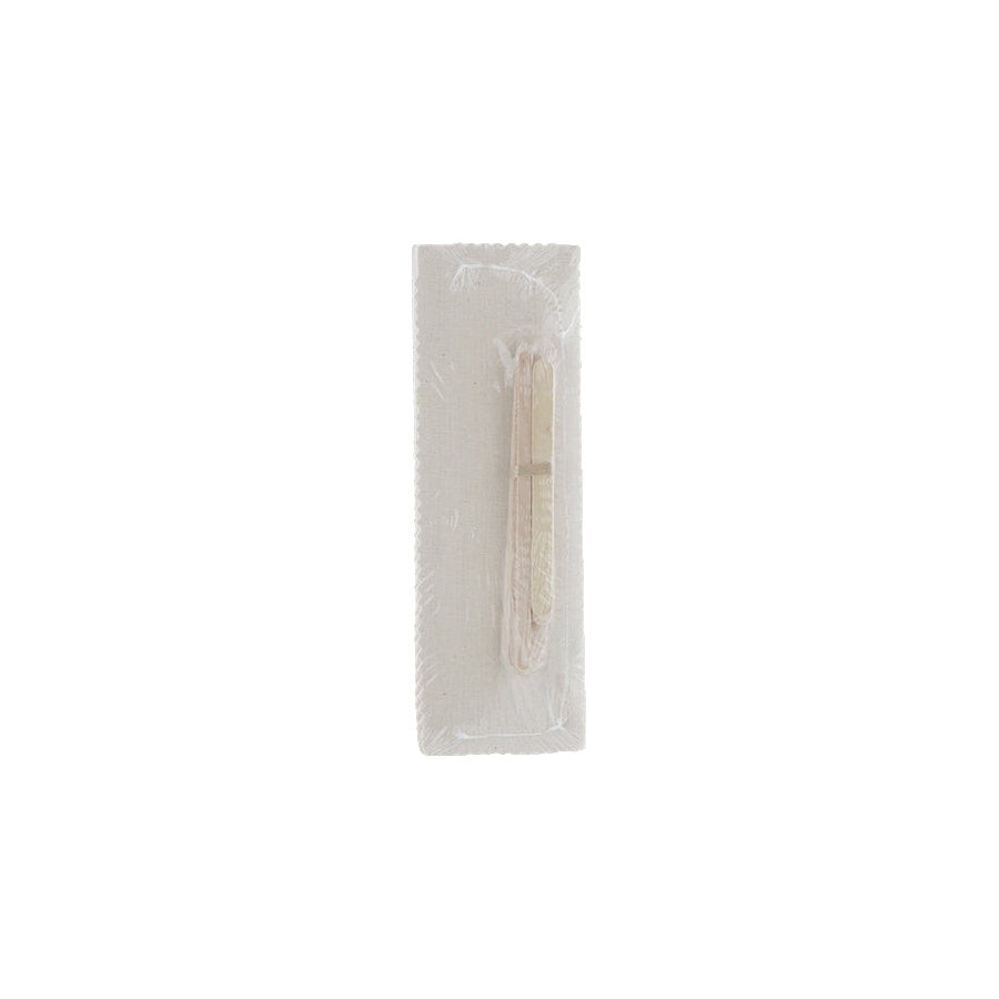 applicators on a clear plastic package on a white background
