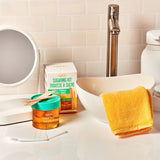 GiGi Sugaring Kit styled on bathroom counter with Sugar Bare jar, towel, and waxing accessories.
